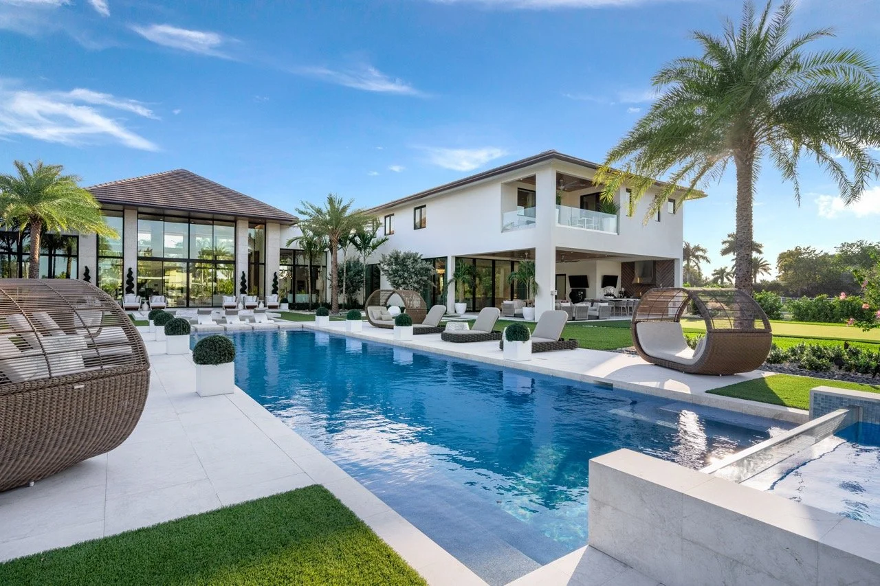 Luxury South Florida home in Southwest Ranches with a swimming pool and palm trees